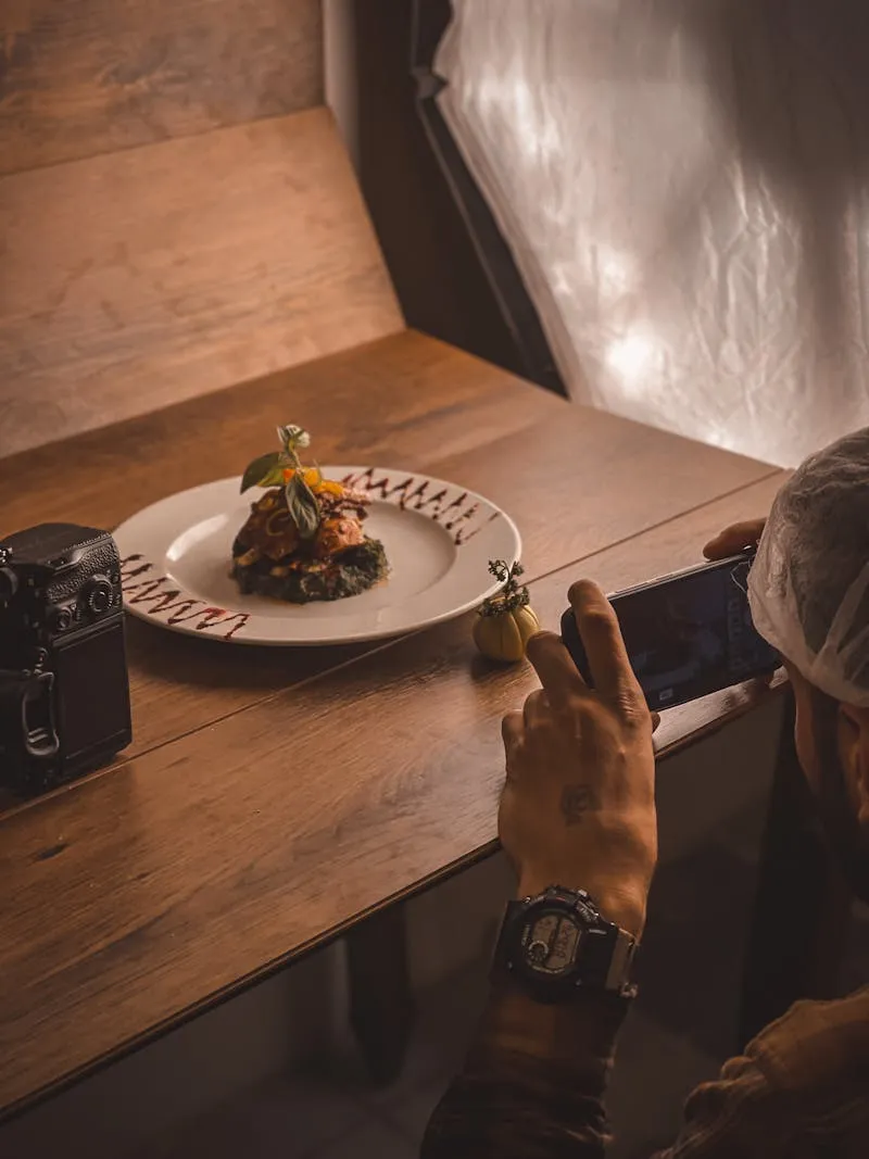 Gourmet food photography — pan-seared duck breast on slate with golden jus